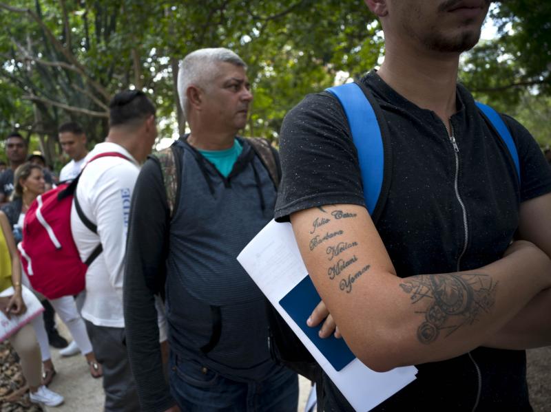 Cubans wait their turn to enter Panama's embassy in Havana to apply for travel visas to Panama last March. The U.S. State Department eliminated a coveted five-year tourist visa for Cubans, dealing a heavy blow to entrepreneurs and Cuban members of divided Cubans wait their turn to enter Panama's embassy in Havana to apply for travel visas to Panama last March. The U.S. State Department eliminated a coveted five-year tourist visa for Cubans, dealing a heavy blow to entrepreneurs and Cuban members of divided