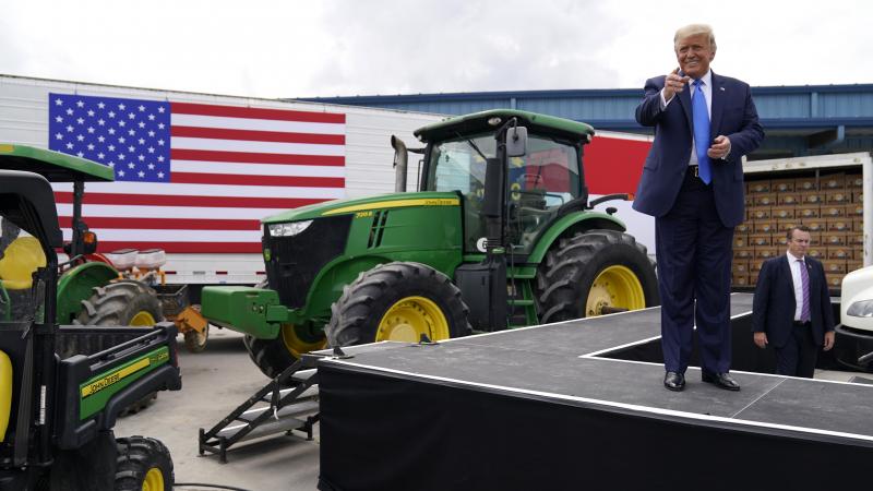 President Trump delivers remarks last week on the Farmers to Families Food Box program at Flavor 1st Growers and Packers in Mills River, N.C. President Trump delivers remarks last week on the Farmers to Families Food Box program at Flavor 1st Growers and Packers in Mills River, N.C.