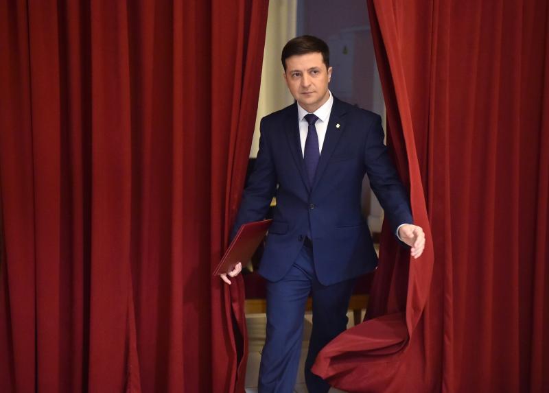 Volodymyr Zelenskiy enters a hall in Kyiv on March 6 to take part in the taping of the television series Servant of the People. His role on the show was as a fictional president of Ukraine. Volodymyr Zelenskiy enters a hall in Kyiv on March 6 to take part in the taping of the television series Servant of the People. His role on the show was as a fictional president of Ukraine.