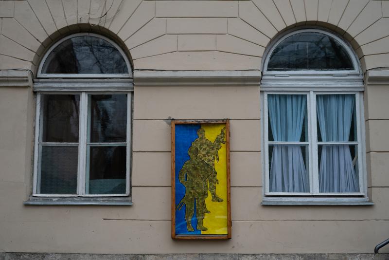A pro-Ukrainian military poster hangs on a building in downtown Lviv, Ukraine. A pro-Ukrainian military poster hangs on a building in downtown Lviv, Ukraine.