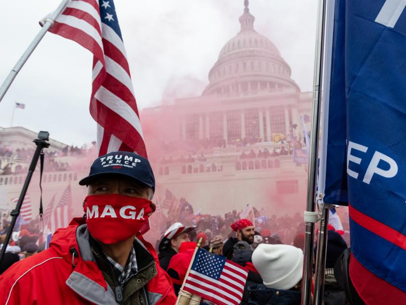 A protester unleashes a smoke grenade in front of the U.S. Capitol building on Jan. 6, 2021. A protester unleashes a smoke grenade in front of the U.S. Capitol building on Jan. 6, 2021.
