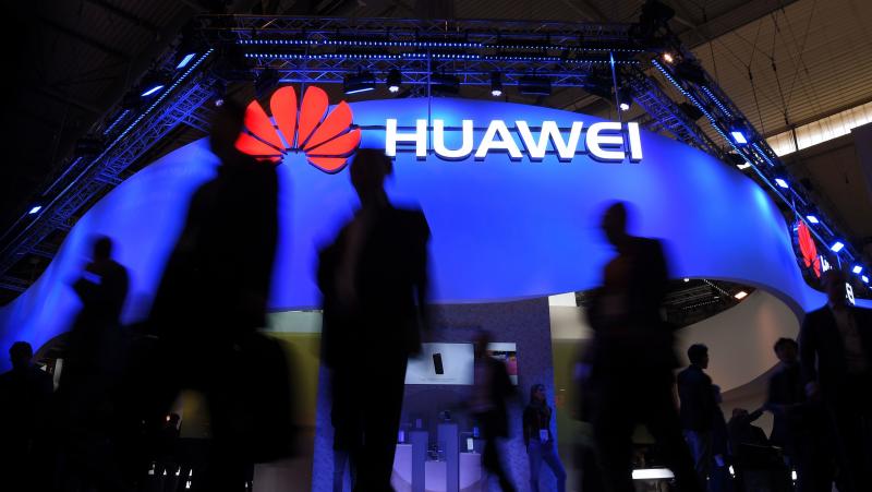Visitors pass a Huawei marquee in Barcelona during the Mobile World Congress last year. The daughter of the Chinese telecommunications giant's founder was arrested Saturday in Canada on U.S. request, in a move that threatens to inflame U.S.-China trade te Visitors pass a Huawei marquee in Barcelona during the Mobile World Congress last year. The daughter of the Chinese telecommunications giant's founder was arrested Saturday in Canada on U.S. request, in a move that threatens to inflame U.S.-China trade te