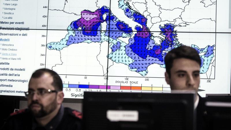 Personnel at work in the operations room of the Italian coast guard in Rome on Sunday during the coordination of relief efforts after a ship carrying hundreds of migrants capsizes off Libyan coast occurred in the Strait of Sicily. Personnel at work in the operations room of the Italian coast guard in Rome on Sunday during the coordination of relief efforts after a ship carrying hundreds of migrants capsizes off Libyan coast occurred in the Strait of Sicily.