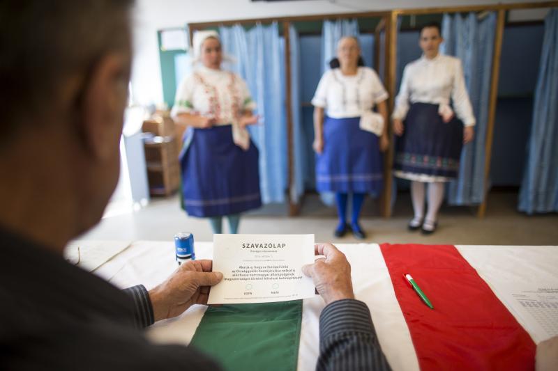 Hungarian women wearing traditional costume cast their ballot at a polling station in Budapest, Hungary, during a referendum on Oct. 2 on refugee resettlement. Hungarian women wearing traditional costume cast their ballot at a polling station in Budapest, Hungary, during a referendum on Oct. 2 on refugee resettlement.