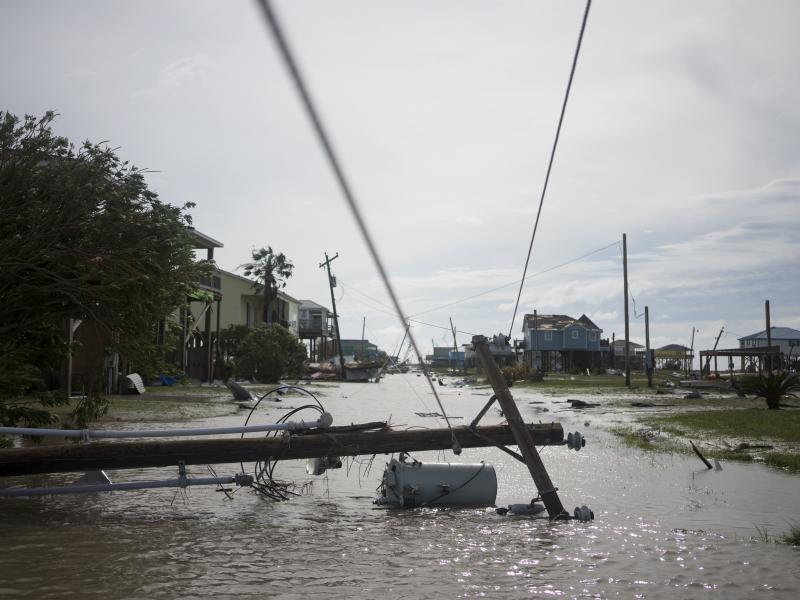 Damaged homes sit among floodwaters after Hurricane Laura passed through the area Thursday in Holly Beach, La. Damaged homes sit among floodwaters after Hurricane Laura passed through the area Thursday in Holly Beach, La.