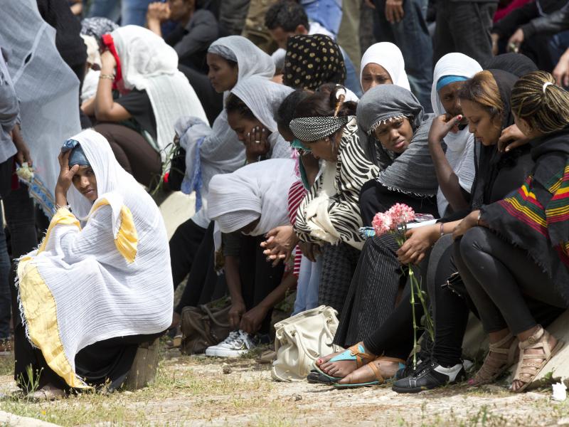 Women grieve as the coffin of one of the 24 migrants who drowned while trying to reach Italy, is buried in Santa Maria Addolorata Cemetery on the outskirts of Valletta, Malta, on April 23, 2015. The migrants died as a smuggler's boat crammed with hundreds Women grieve as the coffin of one of the 24 migrants who drowned while trying to reach Italy, is buried in Santa Maria Addolorata Cemetery on the outskirts of Valletta, Malta, on April 23, 2015. The migrants died as a smuggler's boat crammed with hundreds