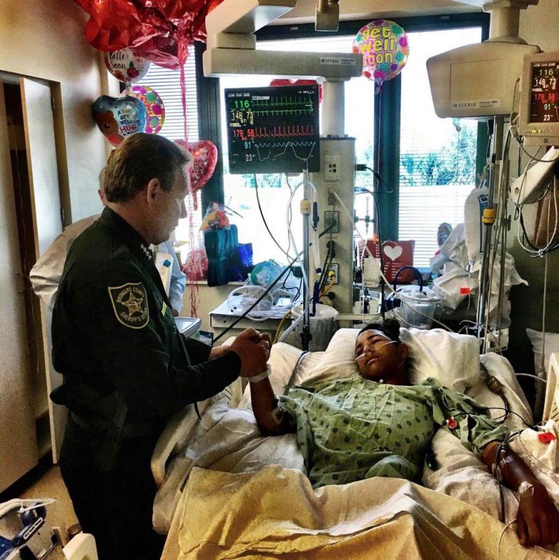 Sheriff Scott Israel, holds the hand of Anthony Borges, 15, a student at Marjory Stoneman Douglas High School in a photo released Feb. 18. Anthony was the last Parkland survivor to be released from the hospital and now his lawyer is preparing a lawsuit ag Sheriff Scott Israel, holds the hand of Anthony Borges, 15, a student at Marjory Stoneman Douglas High School in a photo released Feb. 18. Anthony was the last Parkland survivor to be released from the hospital and now his lawyer is preparing a lawsuit ag