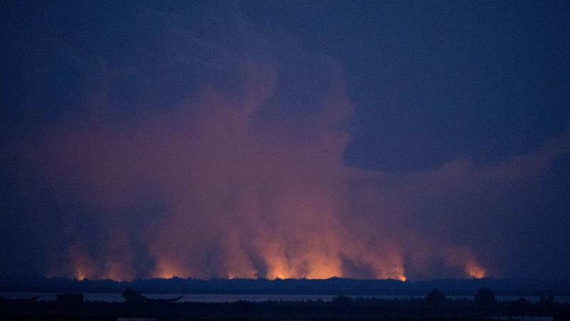 Smoke and flames in Myamar are seen from the Bangladeshi side of the border on Sunday. Smoke and flames in Myamar are seen from the Bangladeshi side of the border on Sunday.