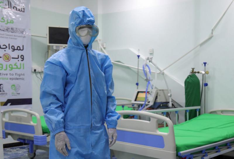 A health worker in personal protective equipment stands in a COVID-19 intensive care unit in Taiz, Yemen. A health worker in personal protective equipment stands in a COVID-19 intensive care unit in Taiz, Yemen.