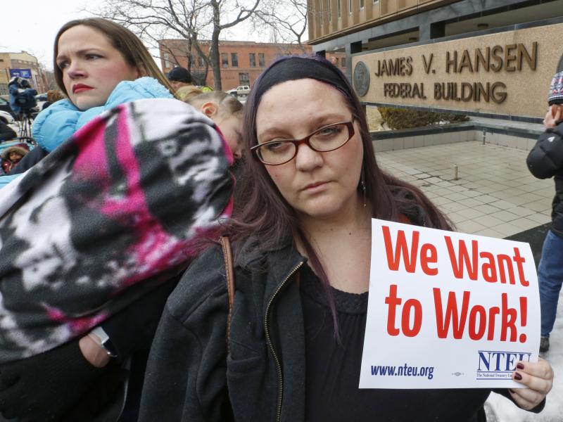 IRS worker Christine Helquist joins a federal workers protest rally against the government shutdown outside the federal building in Ogden, Utah. IRS worker Christine Helquist joins a federal workers protest rally against the government shutdown outside the federal building in Ogden, Utah.