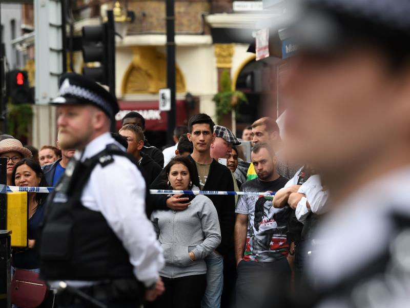 Londoners stand behind a cordon in the East Ham district on Sunday, following a police raid investigating Saturday's terror attacks in Central London. Londoners stand behind a cordon in the East Ham district on Sunday, following a police raid investigating Saturday's terror attacks in Central London.