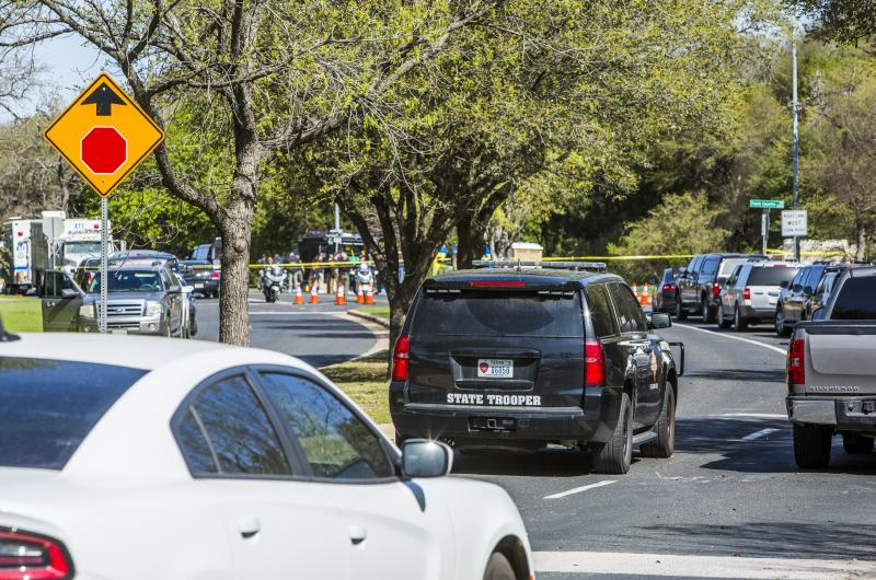 Police tape marks off a neighborhood in Austin, Texas, where a package bomb went off Sunday night, injuring two people. Police tape marks off a neighborhood in Austin, Texas, where a package bomb went off Sunday night, injuring two people.