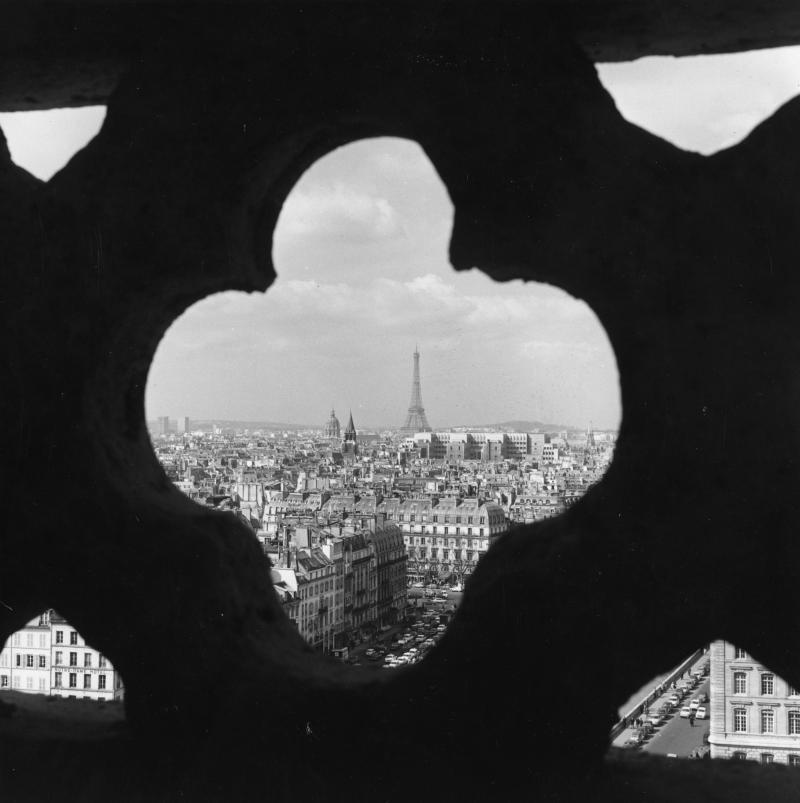 A view of Paris through a detail in the stonework of Notre Dame. A view of Paris through a detail in the stonework of Notre Dame.