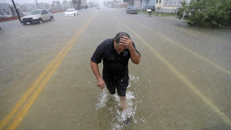 Parts of eastern Texas could see nearly 3 feet of rain through Friday, forecasters say, warning of potential flash floods from Tropical Depression Imelda. Here, Angel Marshman walks through floodwaters in Galveston after trying to start his flooded car We Parts of eastern Texas could see nearly 3 feet of rain through Friday, forecasters say, warning of potential flash floods from Tropical Depression Imelda. Here, Angel Marshman walks through floodwaters in Galveston after trying to start his flooded car We