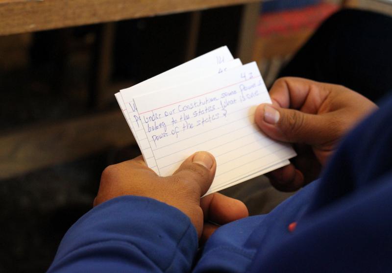 A student uses notecards to learn facts about American government during a class at the public library in Brush, Colo. A student uses notecards to learn facts about American government during a class at the public library in Brush, Colo.