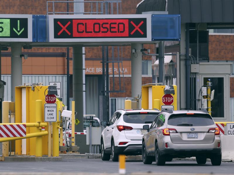 Vehicles wait in line to cross into Canada at the Peace Bridge Plaza on March 18, 2020, in Buffalo N.Y. The Canada-U.S. border will be closed to non-essential traffic in both directions "by mutual consent," President Donald Trump confirmed Wednesday, as e Vehicles wait in line to cross into Canada at the Peace Bridge Plaza on March 18, 2020, in Buffalo N.Y. The Canada-U.S. border will be closed to non-essential traffic in both directions "by mutual consent," President Donald Trump confirmed Wednesday, as e