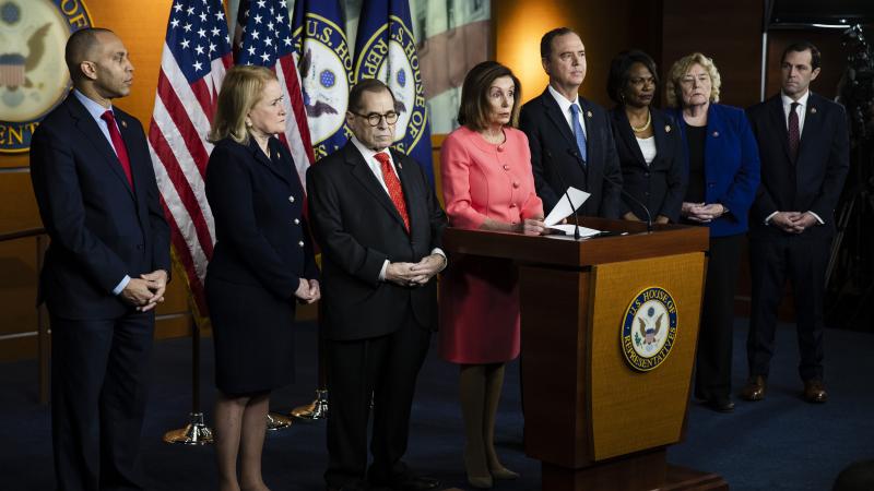 Rep. Jason Crow (far right) and other managers of the House impeachment case join Speaker Nancy Pelosi at a news conference at the Capitol. Rep. Jason Crow (far right) and other managers of the House impeachment case join Speaker Nancy Pelosi at a news conference at the Capitol.