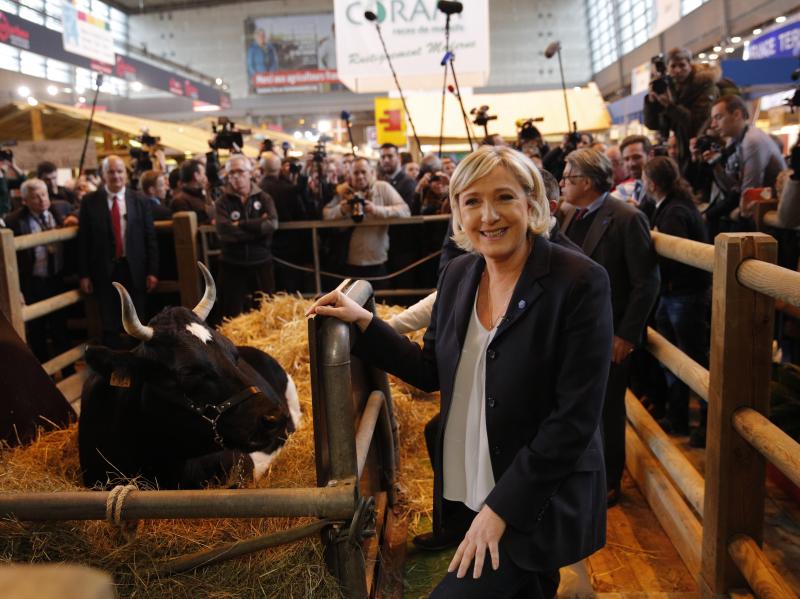 French far-right leader Marine Le Pen attends the 2017 Agriculture Fair on Tuesday in Paris. French far-right leader Marine Le Pen attends the 2017 Agriculture Fair on Tuesday in Paris.