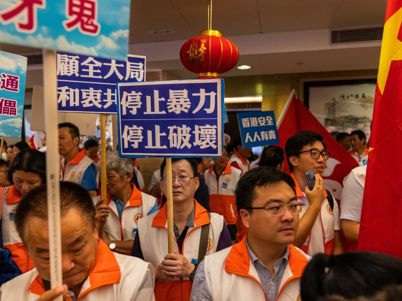 Pro-Beijing demonstrators gather at the Hong Kong Federation of Fujian Associations to show support for the Hong Kong police on Aug. 10. Pro-Beijing demonstrators gather at the Hong Kong Federation of Fujian Associations to show support for the Hong Kong police on Aug. 10.