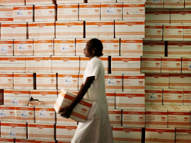 A nutritionist fetches a carton of Plumpy'Nut for malnourished patients at a hospital in Burkina Faso. A nutritionist fetches a carton of Plumpy'Nut for malnourished patients at a hospital in Burkina Faso.
