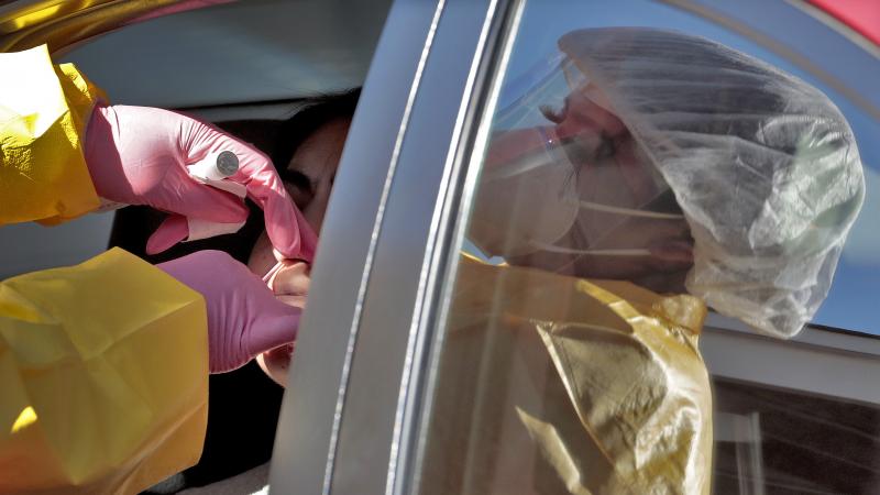 People get tested for the coronavirus at a drive-through site in Phoenix last month. In Arizona, the portion of tests coming back positive now hovers around 24%, more than three times the national average. People get tested for the coronavirus at a drive-through site in Phoenix last month. In Arizona, the portion of tests coming back positive now hovers around 24%, more than three times the national average.