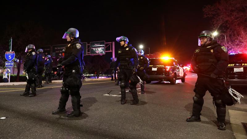 California Highway Patrol officers block an interstate entrance as protesters march. Police use of deadly force became a focus for advocates in California after the district attorney declined to prosecute the officers who fatally shot Stephon Clark, an un California Highway Patrol officers block an interstate entrance as protesters march. Police use of deadly force became a focus for advocates in California after the district attorney declined to prosecute the officers who fatally shot Stephon Clark, an un