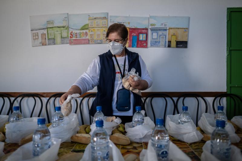 Carmen Monzón, one of the assistants at San Pedro church soup kitchen, organizes lunch bags in Las Palmas, Gran Canaria. Carmen Monzón, one of the assistants at San Pedro church soup kitchen, organizes lunch bags in Las Palmas, Gran Canaria.