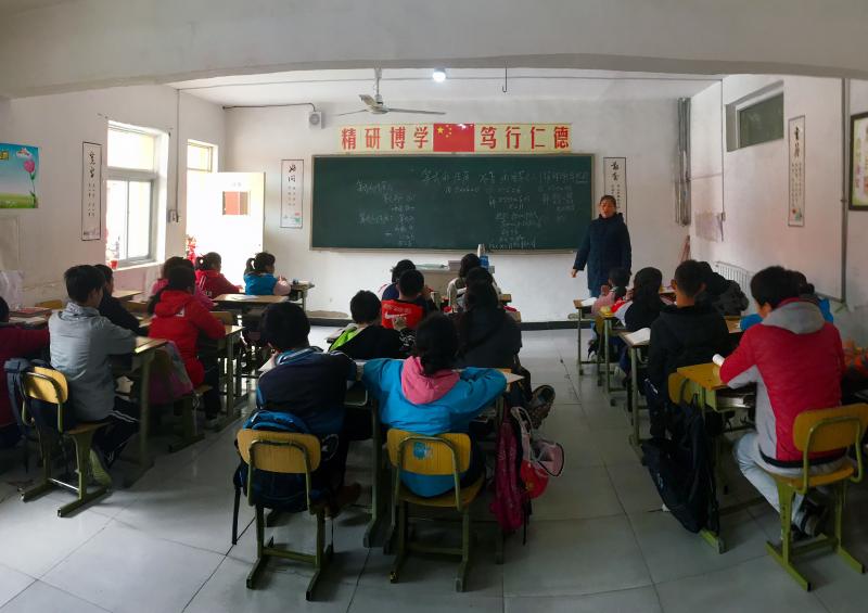Children whose parents have migrated from elsewhere in China sit in a classroom at a private school in Beijing. They are officially still citizens of the rural areas their families come from and not eligible for public education elsewhere. Children whose parents have migrated from elsewhere in China sit in a classroom at a private school in Beijing. They are officially still citizens of the rural areas their families come from and not eligible for public education elsewhere.