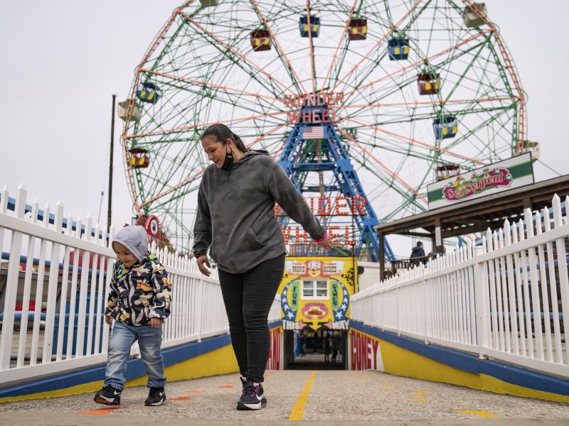 Visitors leave the Wonder Wheel ride after the re-opening of Coney Island's amusement parks on Friday. Visitors leave the Wonder Wheel ride after the re-opening of Coney Island's amusement parks on Friday.