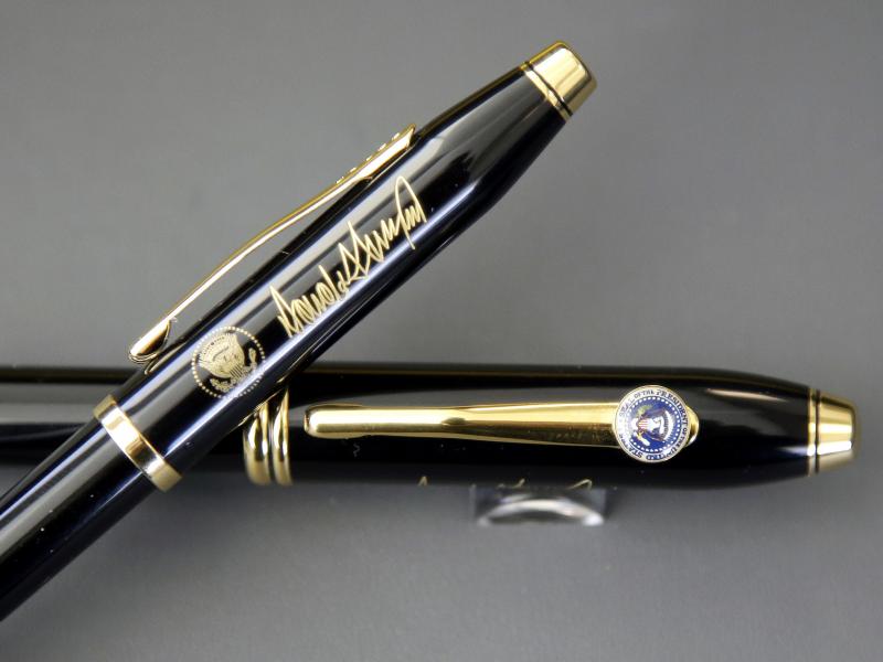 A.T. Cross Co. custom-made pens, designed for President Donald Trump, feature his signature and presidential seals. A.T. Cross Co. custom-made pens, designed for President Donald Trump, feature his signature and presidential seals.