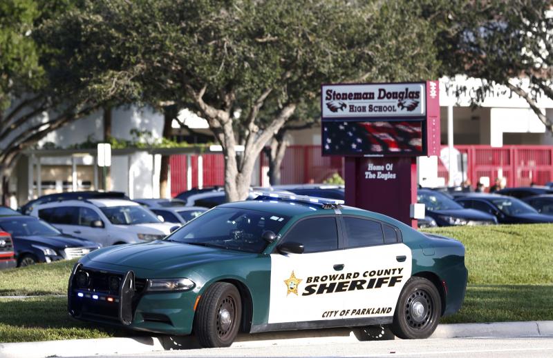 A Broward County Sheriff's Office vehicle is parked outside Marjory Stoneman Douglas High School, in Parkland, Fla. A Broward County Sheriff's Office vehicle is parked outside Marjory Stoneman Douglas High School, in Parkland, Fla.