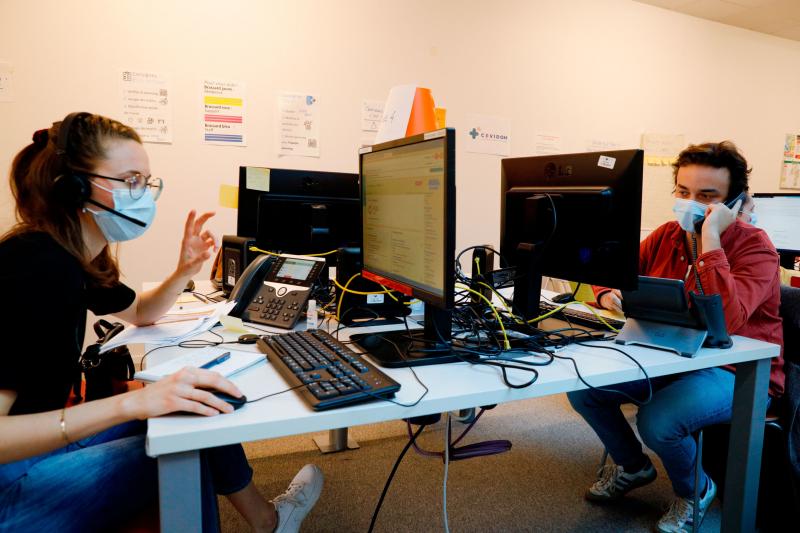 People work in a call center of Covidom, a new remote medical monitoring app, inside the Paris public hospitals' Campus Picpus last month. People work in a call center of Covidom, a new remote medical monitoring app, inside the Paris public hospitals' Campus Picpus last month.