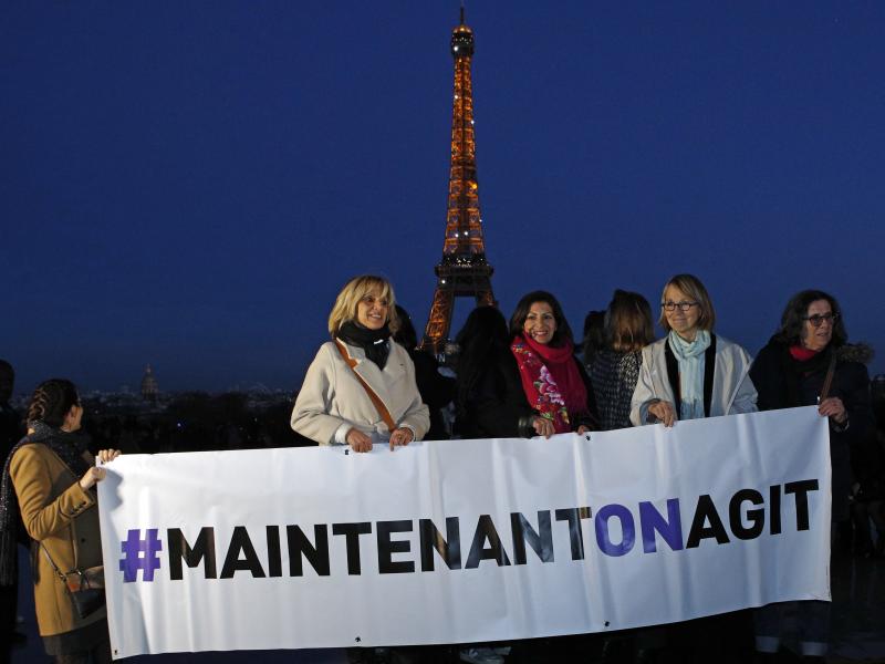 French Culture Minister Françoise Nyssen (second right), Paris Mayor Anne Hidalgo (center) and women's rights activists hold a banner reading "Maintenant on agit" ("Now we act"), on the eve of International Women's Day on March 7. They aim to raise funds French Culture Minister Françoise Nyssen (second right), Paris Mayor Anne Hidalgo (center) and women's rights activists hold a banner reading "Maintenant on agit" ("Now we act"), on the eve of International Women's Day on March 7. They aim to raise funds