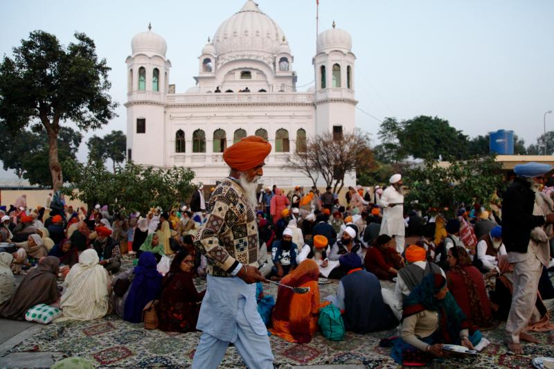 Sikh worshippers gather outside their holiest site, the Gurdwara Darbar Sahib Kartarpur. It is believed to be the place where the founder of Sikhism, Guru Nanak, died in the 16th century. In a rare goodwill gesture this week, India and Pakistan broke grou Sikh worshippers gather outside their holiest site, the Gurdwara Darbar Sahib Kartarpur. It is believed to be the place where the founder of Sikhism, Guru Nanak, died in the 16th century. In a rare goodwill gesture this week, India and Pakistan broke grou