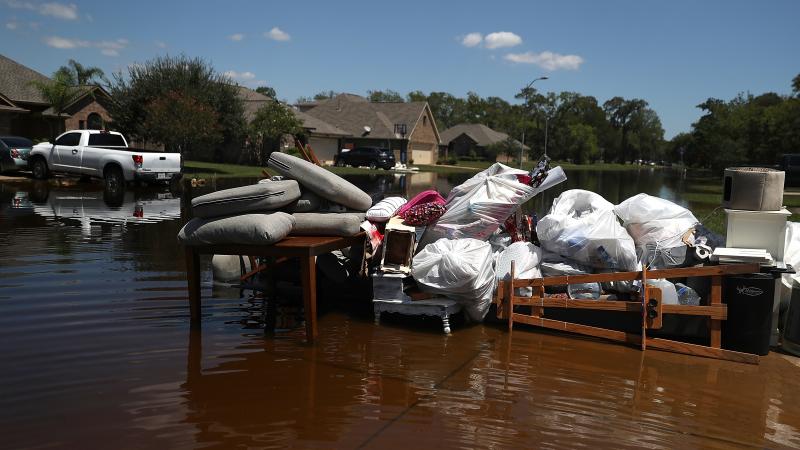Damaged furniture and personal belongings sit in front of a flooded home in September in Richwood, Texas. Several months after Hurricane Harvey hit southern Texas, residents are still navigating the long recovery process. Damaged furniture and personal belongings sit in front of a flooded home in September in Richwood, Texas. Several months after Hurricane Harvey hit southern Texas, residents are still navigating the long recovery process.