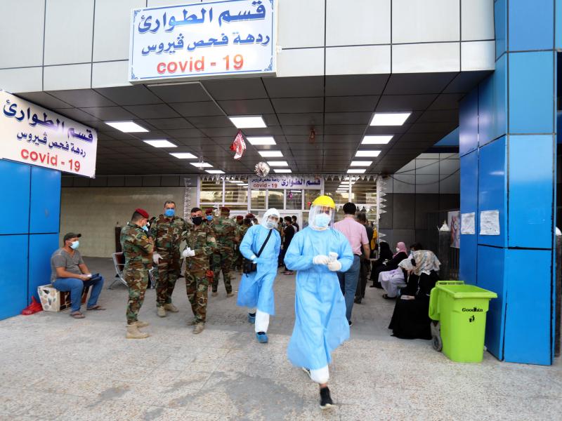 People wait for COVID-19 tests at a hospital in Baghdad on June 4. People wait for COVID-19 tests at a hospital in Baghdad on June 4.