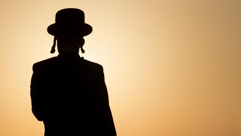 An ultra-Orthodox Jewish man prays along the Mediterranean Sea in the Israeli city of Herzliya, near Tel Aviv. An ultra-Orthodox Jewish man prays along the Mediterranean Sea in the Israeli city of Herzliya, near Tel Aviv.