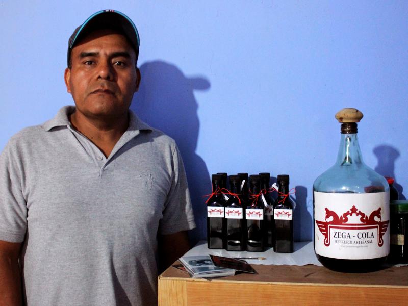 Carpenter Antonio Ambrosio Salvador makes Zega-Cola in Santa Ana Zegache, a small village near Oaxaca, Mexico. Zega-Cola was conceived as a locally made alternative to Coca-Cola, which is ubiquitous in Mexico. Carpenter Antonio Ambrosio Salvador makes Zega-Cola in Santa Ana Zegache, a small village near Oaxaca, Mexico. Zega-Cola was conceived as a locally made alternative to Coca-Cola, which is ubiquitous in Mexico.