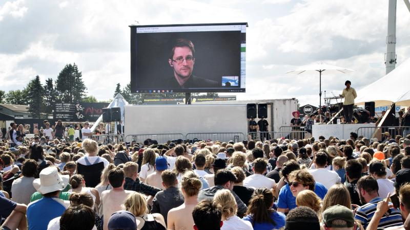 Former NSA contractor Edward Snowden, on a video link in Moscow, speaks to the crowd on a giant screen at festival in Roskilde, Denmark, in 2016. "You are being watched all the time and you have no privacy," Snowden said. Former NSA contractor Edward Snowden, on a video link in Moscow, speaks to the crowd on a giant screen at festival in Roskilde, Denmark, in 2016. "You are being watched all the time and you have no privacy," Snowden said.
