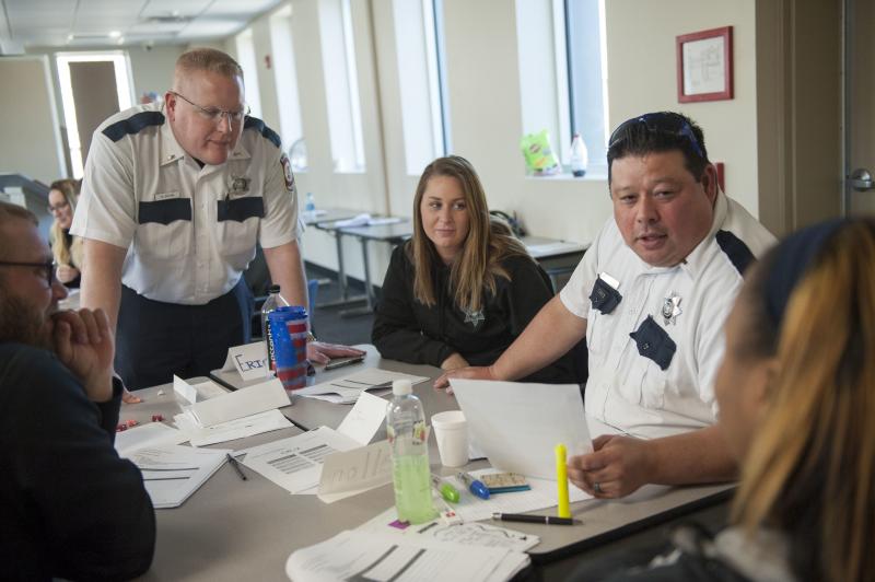 Illinois Department of Corrections officers participate in a role-playing exercise during a March training session on working with female inmates, at Logan Correctional Center in Lincoln, Ill. Illinois Department of Corrections officers participate in a role-playing exercise during a March training session on working with female inmates, at Logan Correctional Center in Lincoln, Ill.