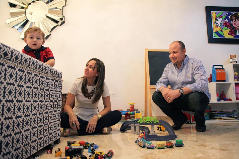 Javier Villa (right) with his wife and son in their home in Puerto Rico. Javier Villa (right) with his wife and son in their home in Puerto Rico.