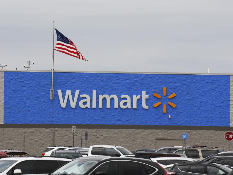 A U.S. flag waves over a Walmart parking lot in August in Oklahoma City. The company sells firearms in about half of its 4,700 stores in the United States. A U.S. flag waves over a Walmart parking lot in August in Oklahoma City. The company sells firearms in about half of its 4,700 stores in the United States.