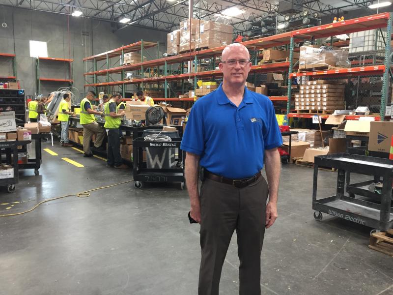 Mark Holohan, solar division manager at Wilson Electric, stands in his company's warehouse outside Phoenix, Ariz. Solar installers say a proposed tariff could sink their business model, while several solar manufacturers say they need shelter from an overs Mark Holohan, solar division manager at Wilson Electric, stands in his company's warehouse outside Phoenix, Ariz. Solar installers say a proposed tariff could sink their business model, while several solar manufacturers say they need shelter from an overs