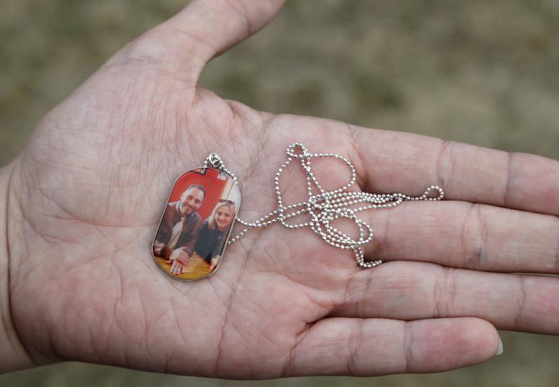 Aya Al-Umari, whose brother Hussein Al-Umari was killed in the Al Noor mosque shooting, holds a pendant with a photo of herself and Hussein during an interview at her home in Christchurch, New Zealand. Aya Al-Umari, whose brother Hussein Al-Umari was killed in the Al Noor mosque shooting, holds a pendant with a photo of herself and Hussein during an interview at her home in Christchurch, New Zealand.