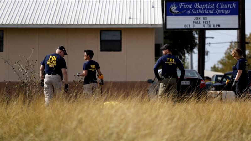 Law enforcement officials investigate the scene of a shooting at the First Baptist Church of Sutherland Springs, Texas, earlier this week in which 26 people were killed. Law enforcement officials investigate the scene of a shooting at the First Baptist Church of Sutherland Springs, Texas, earlier this week in which 26 people were killed.
