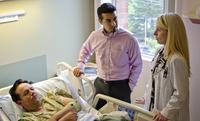 Dr. Angela Alday talks with Isidro Hernandes, via a Spanish-speaking interpreter, Armando Jimenez. Both patient and doctor say they much prefer an in-person interpreter to one on the phone. Dr. Angela Alday talks with Isidro Hernandes, via a Spanish-speaking interpreter, Armando Jimenez. Both patient and doctor say they much prefer an in-person interpreter to one on the phone.