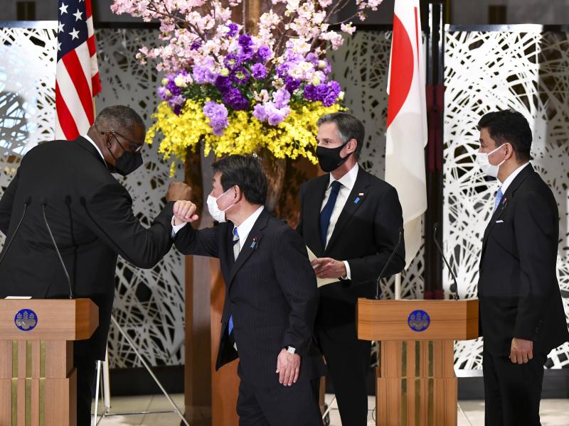U.S. Defense Secretary Lloyd Austin, left, elbow bumps with Japan's Foreign Minister Toshimitsu Motegi, center, as Secretary of State Antony Blinken and Japanese Defense Minister Nobuo Kishi watch after a joint news conference in Tokyo Tuesday. U.S. Defense Secretary Lloyd Austin, left, elbow bumps with Japan's Foreign Minister Toshimitsu Motegi, center, as Secretary of State Antony Blinken and Japanese Defense Minister Nobuo Kishi watch after a joint news conference in Tokyo Tuesday.