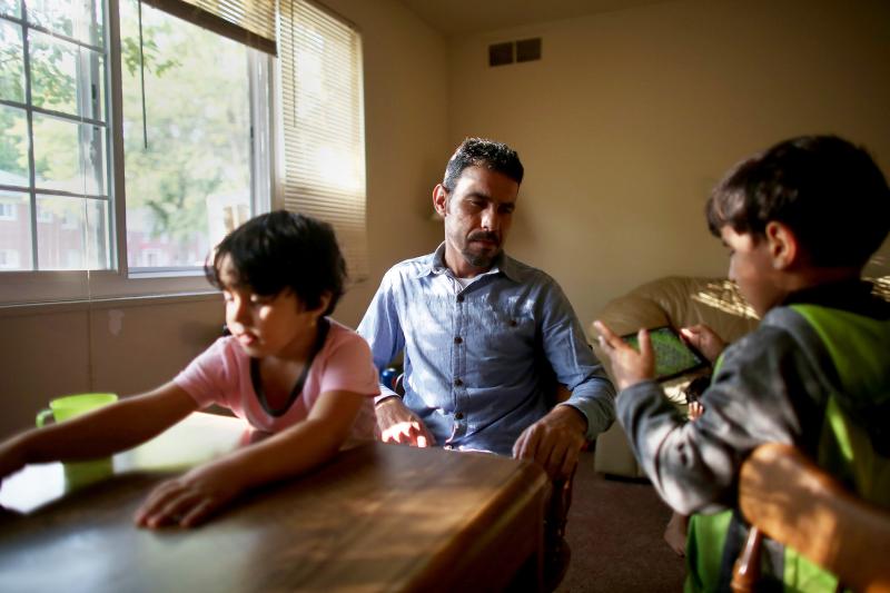Omar Al-Awad sits with his daughter Taiba (left) and son Abdul-Jabar in their Toledo apartment in 2015. Omar Al-Awad sits with his daughter Taiba (left) and son Abdul-Jabar in their Toledo apartment in 2015.