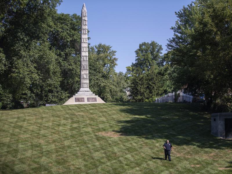 A guard walks past a monument at North Alton Confederate Cemetery in Alton, Ill. The federal government has hired private security firms to guard several Confederate memorials across the U.S in the aftermath of clashes between white nationalists and count A guard walks past a monument at North Alton Confederate Cemetery in Alton, Ill. The federal government has hired private security firms to guard several Confederate memorials across the U.S in the aftermath of clashes between white nationalists and count