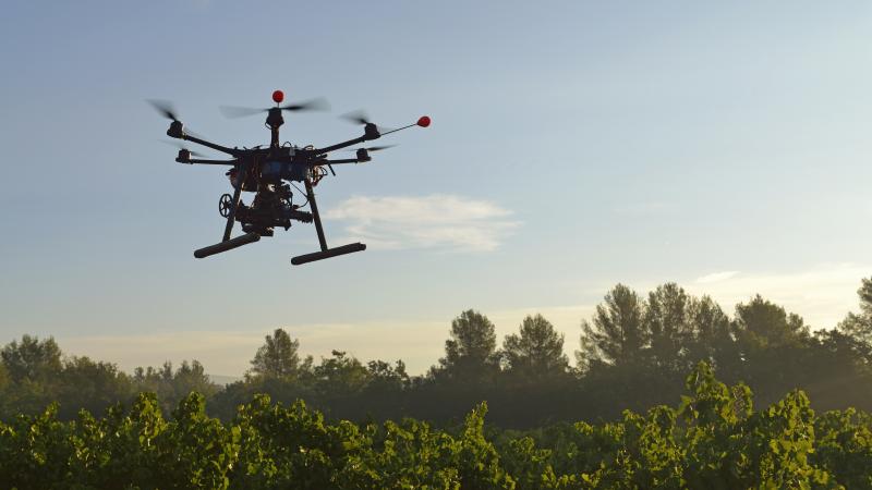 An unmanned aerial vehicle films vineyards in France. Drones like this one are also being used in Califiornia, as part of a broader "precision farming" movement designed to lower greenhouse gas emissions. An unmanned aerial vehicle films vineyards in France. Drones like this one are also being used in Califiornia, as part of a broader "precision farming" movement designed to lower greenhouse gas emissions.